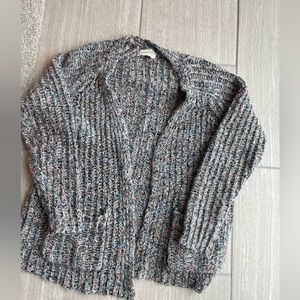 Universal thread marked sweater